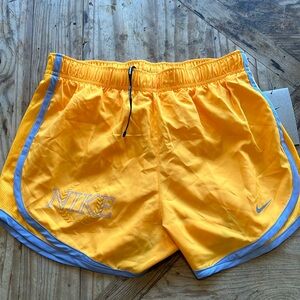 Size small Nike DriFit ladies lined orange running shorts